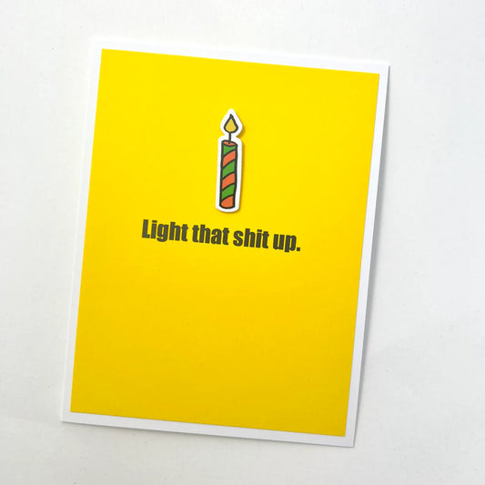 Yellow card with a candle graphic and text on a white background