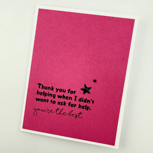 Pink card with black text and a star on a white background