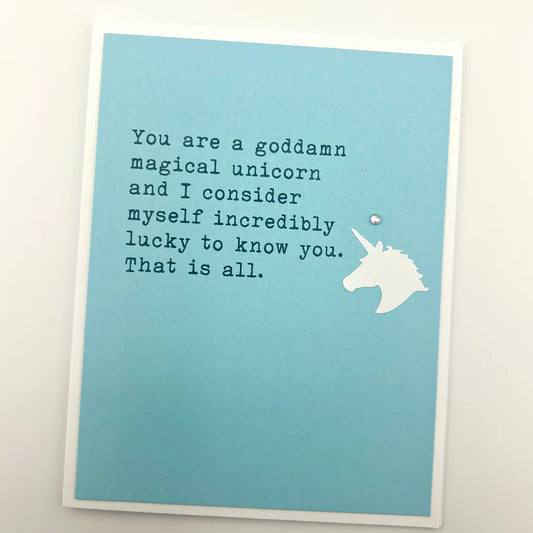 Card with unicorn illustration and text on a blue background
