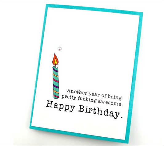 Birthday card with a colorful candle illustration and humorous text on a white background.