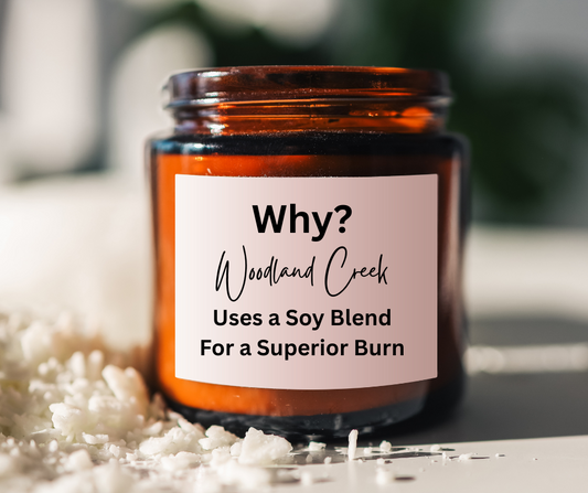 candle jar and solid candle wax on the side - the jar states: Why? Woodland Creek Uses a Soy Blend for a Superior Burn